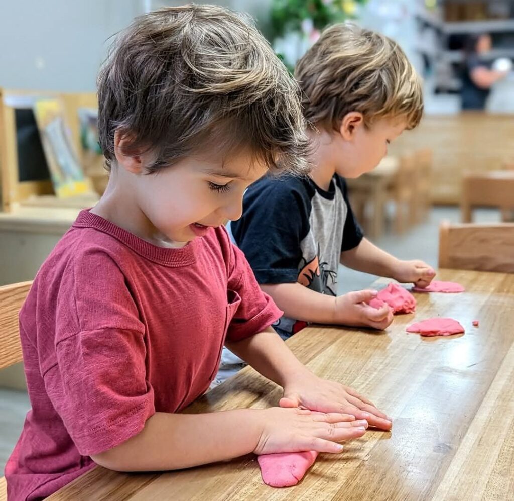 Children engaged in occupational therapy handwriting session